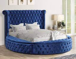 round blue velvet tufted bed with storage