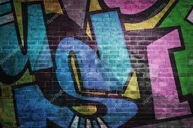 Colorful Graffiti Letters On Brick Wall