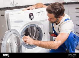 Washing machine repair hi-res stock photography and images - Alamy