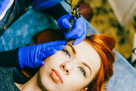 cosmetologist applying permanent makeup