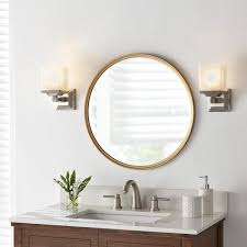 This bathroom mirror with shelf has a solid construction and a clean white finish to blend beautifully with any style of bathroom decor. Home Decorators Collection 24 In W X 24 In H Framed Round Anti Fog Bathroom Vanity Mirror In Gold 45383 The Home Depot