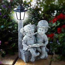 Reading Boy And Girl With Solar Light
