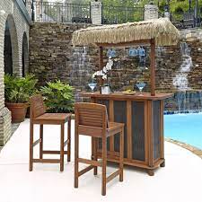 outdoor patio tiki bar and 2 stools