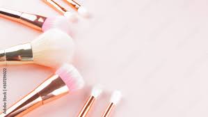 makeup brushes on pink background set