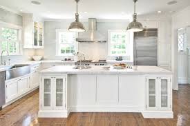 white kitchen cabinets with stainless