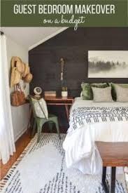 Add a couple of table lamps to help diffuse the light around the room, or pick up a decorative lamp that will throw pretty shadow patterns across the walls. Room Reveal Guest Bedroom Makeover On A Small Budget Simplicity In The South