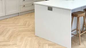 lay the floor or fit the kitchen first