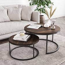 Nest coffee tables are a great way of adding more surface space to rooms when you don't have as well as this traditional set of three nesting tables, it is also available as one large coffee table and two smaller side tables which things to consider. Amazon Com Nathan James Stella Round Modern Nesting Coffee Set Of 2 Stacking Living Room Accent Tables With An Industrial Wood Finish And Powder Coated Metal Frame Warm Nutmeg Matte Black Furniture Decor