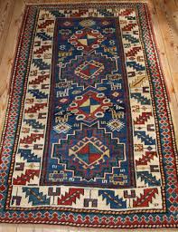 antique caucasian kazak rug with bold