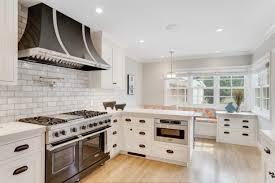 white cabinets and black appliances