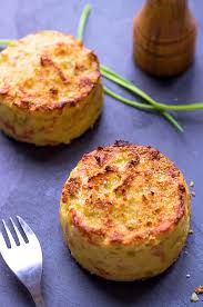The potatoes are purchased, washed, peeled, sliced, cooked, and mashed with a potato masher or mixer. Oven Baked Mashed Potato Cakes Recipe Baked Potato Cakes Recipe Eatwell101