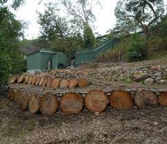 retaining walls with logs landscaping