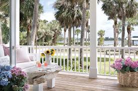 Covered Porch With White Wooden Railing