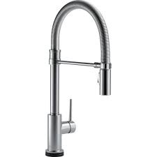 Any time working under a sink is challenging. Delta Trinsic Pro Single Handle Pull Down Sprayer Kitchen Faucet With Touch2o Technology And Spring Spout In Arctic Stainless 9659t Ar Dst The Home Depot