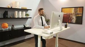 An adjustable standing desk allows you to quickly and conveniently vary whether you work while standing up or sitting down. This Desk Reminds You To Stand Up If You Ve Been Sitting Too Long And