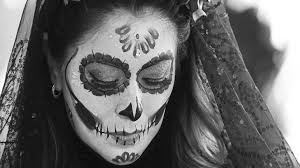 young woman in catrina makeup for dia