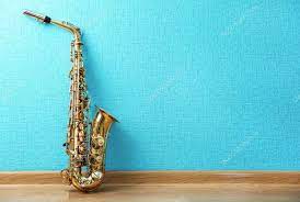 saxophone on turquoise wallpaper