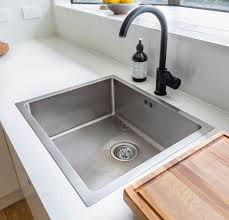 fix the pipes under the kitchen sink