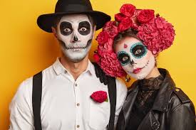 dead woman and man wears skull makeup