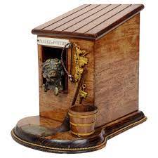 cigar box with a terrier in a dog house