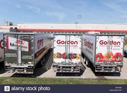 Semi Trucks And Trailers Featuring Gordon Food Service Logos Outside