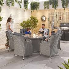 The fire table is rather compact and will not take over too much space. Nova Thalia 6 Seat Dining Set With Round Fire Pit Table Cambridge Home Garden
