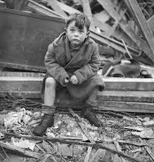 Child amongst World War II bomb damage, London, UK - Stock Image -  C047/5427 - Science Photo Library