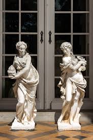 white painted concrete garden statues