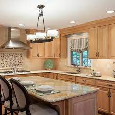 Lightening your dark wood kitchen cabinets is one idea you should feel to try out. Photos Hgtv