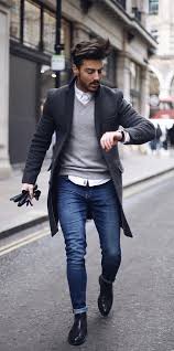 Men outfits with blue jeans. Rowanrow With A Fall Combo Idea With A Gray V Neck Sweater White Button Up Shirt Dark Gray Topcoat Watch Coat Outfit Casual Mens Fashion Classy Mens Outfits