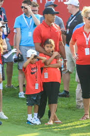 Tiger woods can best be described as the most accomplished golfer of all time. Tiger Woods Attends The Quicken Loans National Pga Golf Tournament With Children Sam Charlie