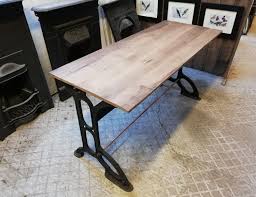 Crafted of reclaimed pine, this rustic desk is a showpiece that highlights the beauty of the wood's natural markings and organic grain while keeping a caring eye on our environment. M1211 Industrial Office Desk With Reclaimed Oak Top Cast Iron Base