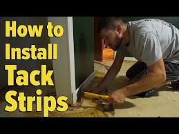 install tack strips on a concrete floor