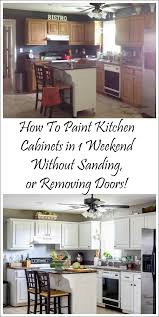 These diy painted kitchen cabinets changed the entire look of my kitchen with a little elbow grease and minimal financial investment. How I Painted My Kitchen Cabinets Without Removing The Doors Painting Kitchen Cabinets White Painting Kitchen Cabinets Kitchen Renovation