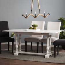 This white farmhouse dining table comes with an 18 leaf so you can comfortable fit everyone at the table. Eddlewood Farmhouse Drop Leaf Trestle Console To Dining Table