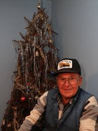 man s christmas tree still stands after