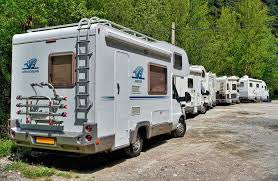 This is one of our previous class b vans in a parking lot at yellowstone national park. Which Class Rv Is Best For Full Time Travel Go Nomadic Life