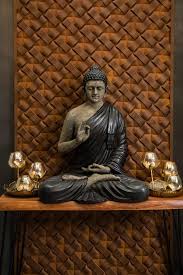 Home Decor With A Gold Statue Of Buddha Against A Black Wall With An Ethnic  Pattern gambar png
