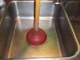 unclog a double kitchen sink drain