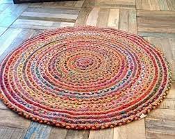 beige hand braided jute round rug at rs