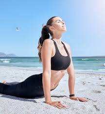 beach yoga health and woman stretching
