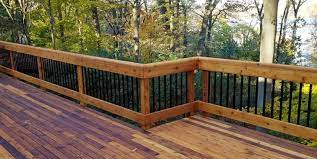 Deckorators spindles wood deck with horizontal skirting deck boards the handrails were placed in from the edge of the steps so flower pots could sit. Elevate Your Outdoor Living Space With The Most Popular Wood Deck Railing Ideas Designs And Tips For 2020 Decksdirect
