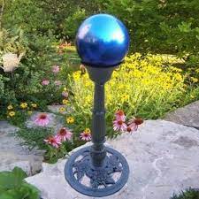 blue gazing ball with tall stand