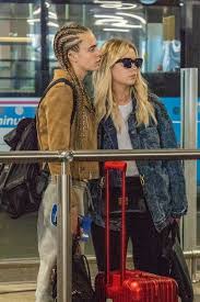 They kissed and were smiling in the photos. Cara Delevingne Confirms Ashley Benson Romance With Lingering Kiss At Heathrow Airport As New Love Wears C Necklace Irish Mirror Online