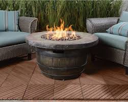 The warmth of a fire pit will instantly cozy up any outdoor room. Fire Pit Tables Insteading