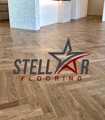 Chanelle is creating a design for vinyl flooring. Stellar Flooring Home Facebook