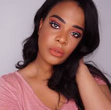 trending peach makeup look on dark skin