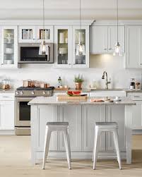 Lay the cabinet doors out flat with the backside facing up, and then use a paint roller to apply a thin coat of white cabinet enamel. How To Paint Kitchen Cabinets Martha Stewart