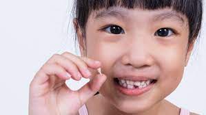 Pull the tooth out by hand. Should You Help Your Child Pull A Loose Tooth