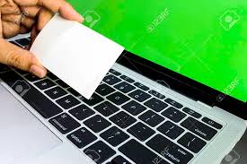 Hands Using Laptop And Check Business Cards For Calling Online